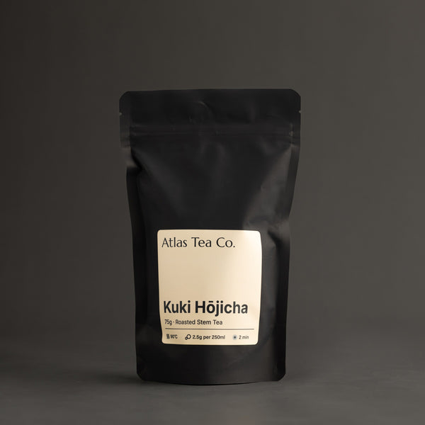 Kuki Hojicha tea packaging with 'Atlas Tea Co.' label on a dark background